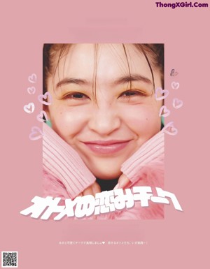 A woman in a pink shirt with her hands on her face.