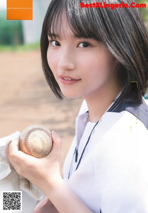 A magazine with a girl in a school uniform on the cover.