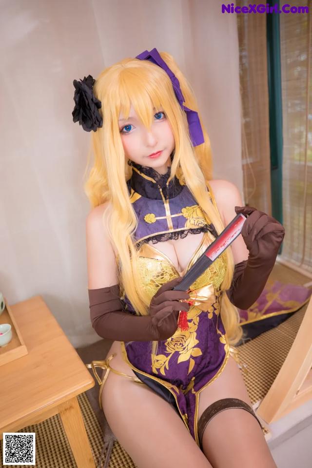 A woman in a purple and gold outfit holding a knife.