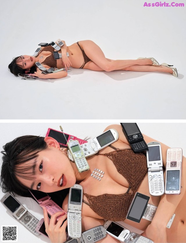 A woman laying on the ground with many cell phones around her.